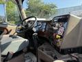 Interior view of a 2007 International 9200i truck featuring a steering wheel dashboard and various controls