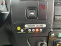 Dashboard controls of a 2017 Chevrolet Express including a warning light for door ajar and interlock system buttons