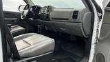 The interior of a 2013 Chevrolet Silverado 1500 with a driver's seat and dashboard visible showing controls and features