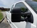 A 2008 Ford F-250 SD pickup truck showcasing the driver's side mirror with a black casing