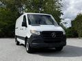 A white 2020 Mercedes-Benz Sprinter van facing forward with a black front grille and no visible branding on the side