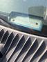 A 2009 Ford Econoline with a visible VIN plate located on the dashboard