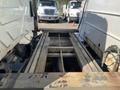 A 2007 International 7300 with an exposed chassis and frame showing metal beams and connectors
