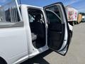A white 2019 RAM 1500 Classic with an open passenger door and visible interior seating