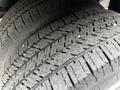 Close-up of the tread on a tire from a 2021 Ford E-450 showing detailed patterns and grooves designed for traction and grip
