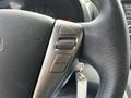 A close-up of the steering wheel of a 2020 Nissan NV200 showing control buttons for cancel accelerate coast set and on off