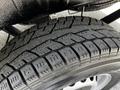 Close-up of a winter tire displaying detailed tread patterns mounted on a 2020 Mercedes-Benz Sprinter