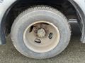 A close-up of a tire and wheel from a 2017 Chevrolet Express showing the wheel rim and tire tread patterns