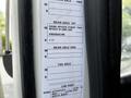 A detailed specification sheet attached to a vehicle with sections for axle information and cab paint approval