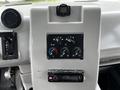 Dashboard of a 2015 Spartan School Bus featuring control knobs for temperature and ventilation along with a radio and other controls