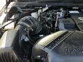 Close-up of the engine compartment of a 2022 RAM 3500 showing the air intake and various engine components