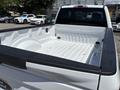A 2020 Ford F-350 SD with an empty truck bed and black bed liner along the edges