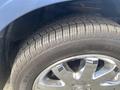 A close-up of a tire on a 2007 Chrysler PT Cruiser showing the tread pattern and rim design