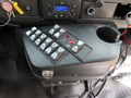 A control panel with various buttons and a temperature display in the driver's area of a 2020 Chevrolet Express