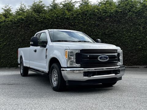 A white 2017 Ford F-250 pickup truck parked with chrome details and a prominent front grille featuring the Ford logo