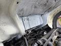 Close-up view of the engine compartment of a 2008 International CityStar showing the underside of the hood and engine components