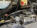 Close-up of the engine compartment of a 2008 Morgan Olson Workhorse showing various components including hoses electrical connections and a radiator cap