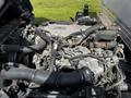 A 2016 Isuzu NQR engine with various pipes and components visible including hoses and an intake manifold