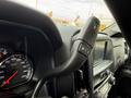Close-up view of the interior controls of a 2018 Chevrolet Silverado 1500 showing the steering wheel and dashboard instruments