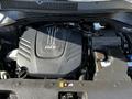 The image shows the engine compartment of a 2017 Kia Sorento featuring a large black engine cover with GDI branding and various mechanical components