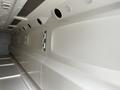 A 40 foot custom climate controlled storage container with smooth white interior walls and multiple ventilation openings along the sides