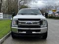 A 2017 Ford F-550 truck facing forward with a chrome grille and the Ford logo prominently displayed on the front