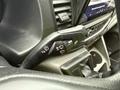 Close-up of the control stalk inside a 2023 Ford Transit featuring buttons for wipers and turn signals