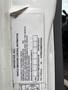 A 2014 International Durastar vehicle emissions control information label with specifications and compliance details