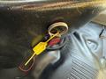 A yellow pull cable is attached to a black handle labeled FIRE on the dashboard of a 2017 Chevrolet Express van