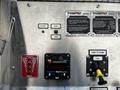 Control panel of a 2006 Emergency One Fire Truck featuring buttons for foam level, pump operations, and instructions for use