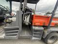 A 2011 Kubota RTV 1140 CPX with a red dump bed and black seating area visible in the foreground