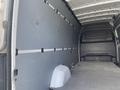 2025 Mercedes-Benz Sprinter cargo van interior featuring a gray panel system and flat flooring with smooth surfaces