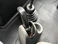 Gear shift lever and boot along with a cup holder in the interior of a 2006 International 4200
