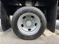 Close-up view of a Goodyear G661 HSA tire mounted on a 2011 International 4300 truck's wheel showing detailed tread and rim design