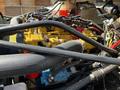 2004 Freightliner M2 engine with various components including yellow and blue parts along with multiple hoses and wiring connections
