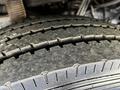 Close-up of a tire tread from a 2000 Ford Motorhome showcasing rugged grooves and patterns designed for traction and durability