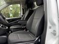 Interior of a 2020 Mercedes-Benz Metris showing two front seats with black fabric upholstery and a steering wheel