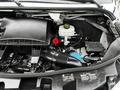 The image shows the engine compartment of a 2019 Mercedes-Benz Sprinter displaying the engine components and various fluid reservoirs