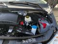 A 2017 Mercedes-Benz Sprinter with the hood open showing its engine compartment including the air intake, battery, and fluid reservoirs