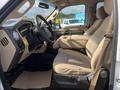 Interior view of a 2014 Ford F-350 SD showing the driver's seat and dashboard with controls and features