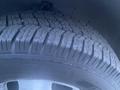 Close-up of a tire from a 2017 Chevrolet Express showcasing its tread pattern and design