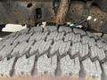 Close-up of a tire with a rugged tread pattern showing wear and tear on a 2003 Ford F-450 SD