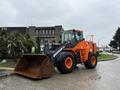2018 Doosan DL300-5 wheeled loader with a large bucket in the front and an orange and black color scheme