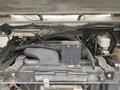 Engine compartment of a 2012 Ford Econoline showing the engine components and wiring