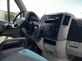 Interior view of a 2012 Mercedes-Benz Sprinter with a steering wheel dashboard and controls visible
