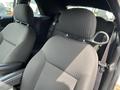 Interior view of a 2005 Chrysler PT Cruiser showing the front seats with fabric upholstery and headrests