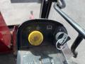 Control panel of a 2014 Toro Groundmaster 5910 featuring buttons for lights an ignition key and a yellow dial