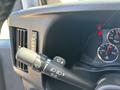 Close-up of the control lever on the steering column of a 2019 GMC Savana featuring settings for wipers and turn signals