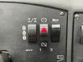 Controls and switches of a 2014 Caterpillar TL1055C including lift and parking indicators along with a horn button