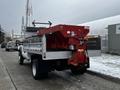2008 Ford F-450 SD with a flatbed and attached red salt spreader at the rear